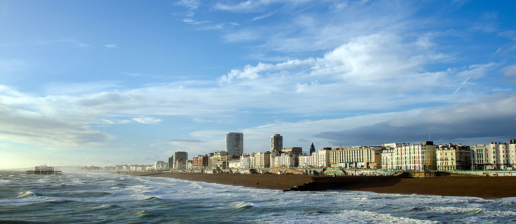 Late afternoon sunshine on Brighton Beach and the remains of the West Pier.